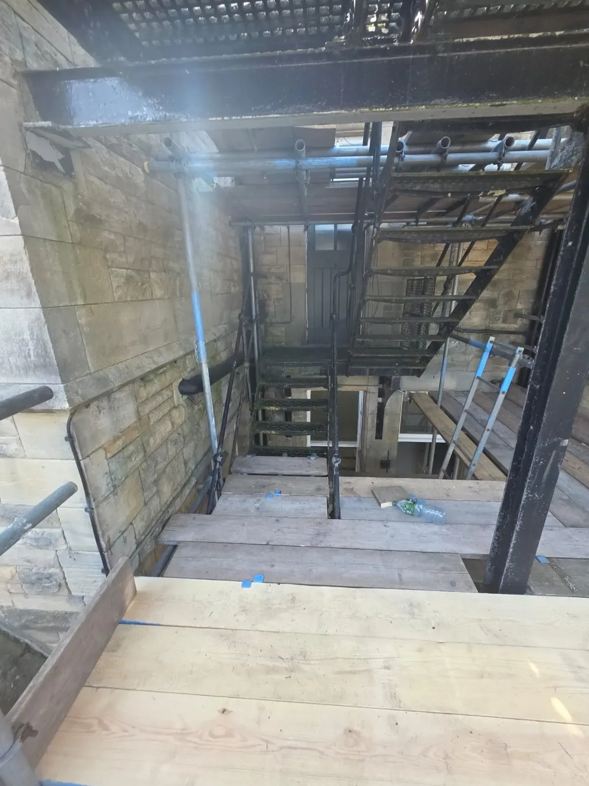Temporary staircase scaffold inside a steel framed building