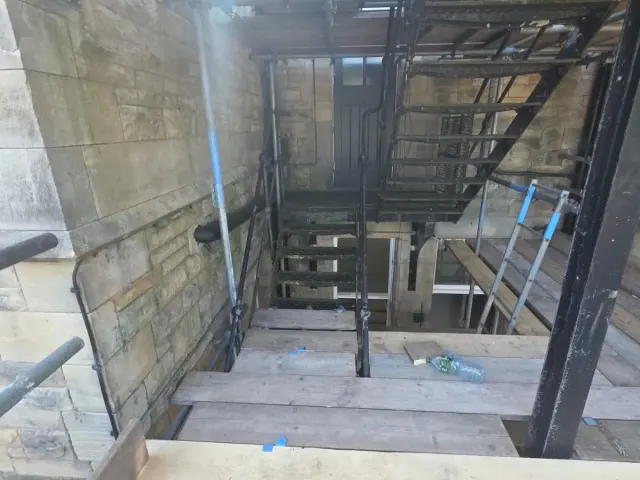 Temporary staircase scaffold inside a steel framed building