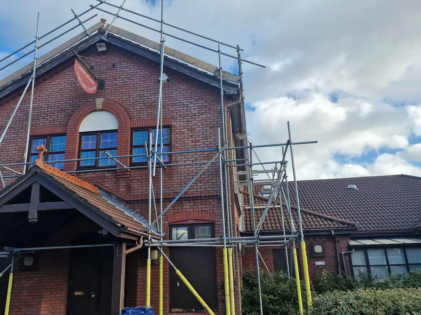 Scaffolding on a detached brick house