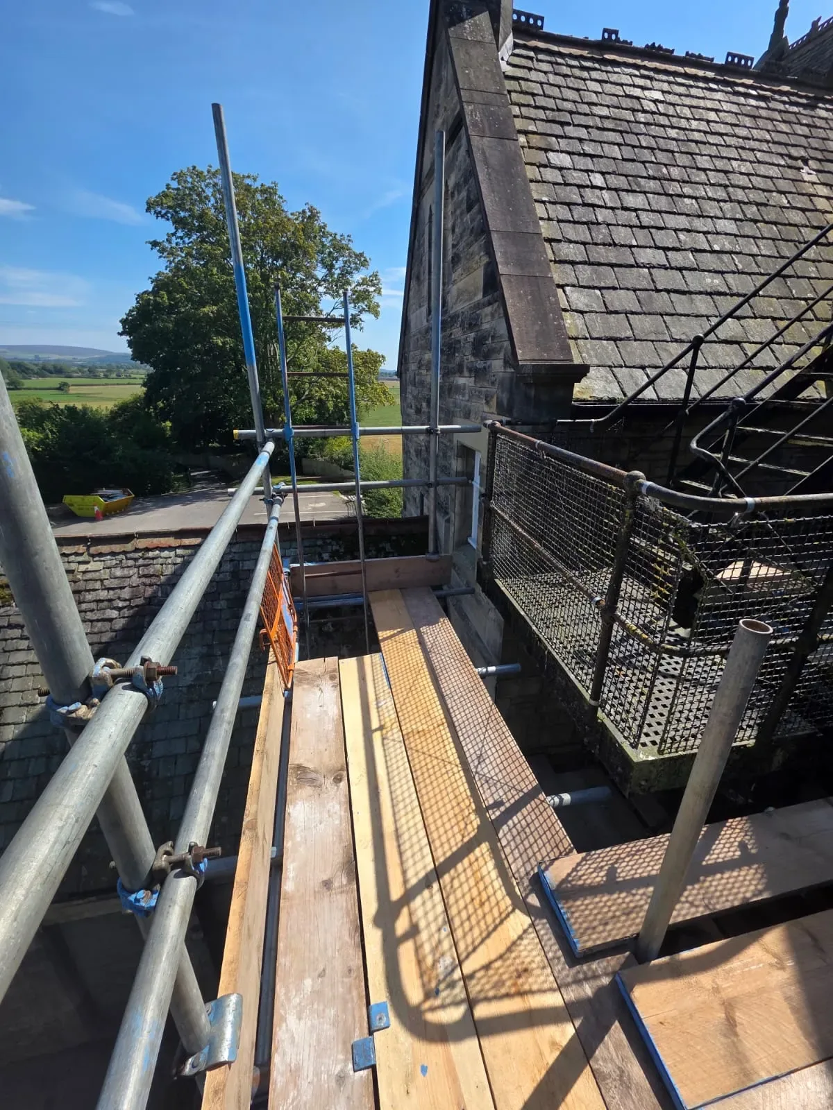 Boarded scaffold lift on a stone barn conversion