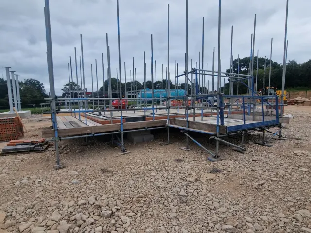 Bricklayers scaffold platforms on a new build plot — Preston Scaffolding NW, scaffolders covering Bonds