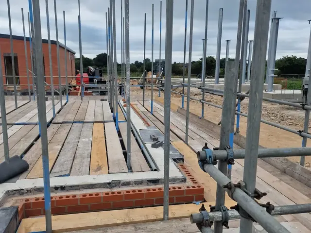 Scaffold loading platforms on a housing development — Preston Scaffolding NW, scaffolders covering Lancaster